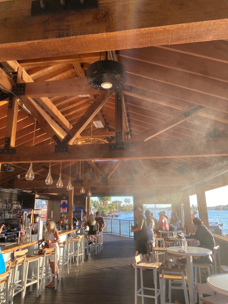 Misting fans installed on commercial restaurant patio by Advanced Misting Systems